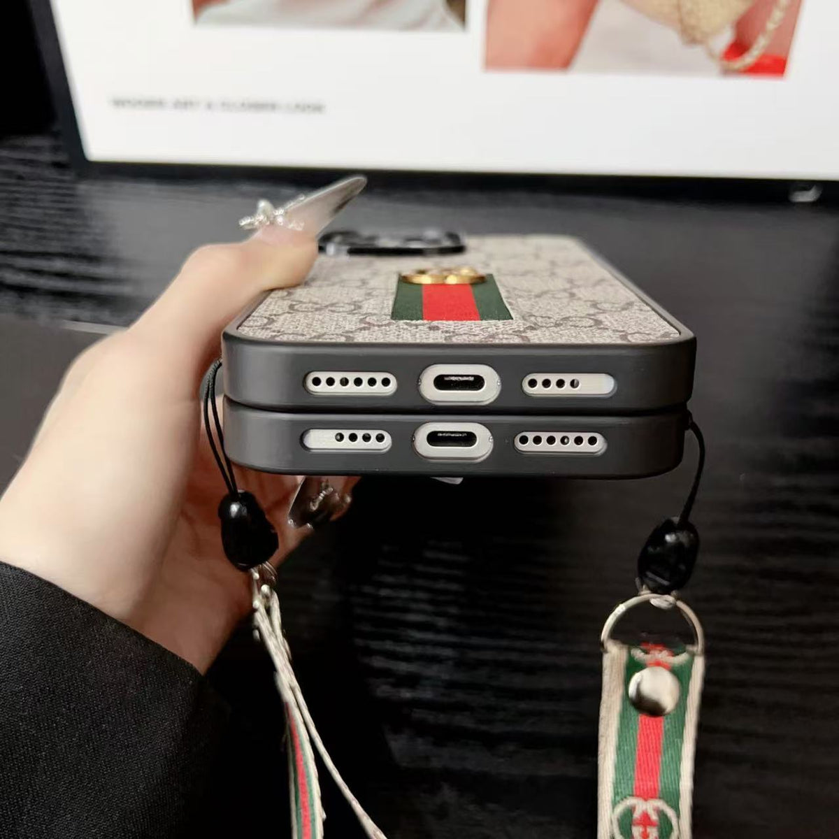 Gucci-inspired iPhone case with hand strap