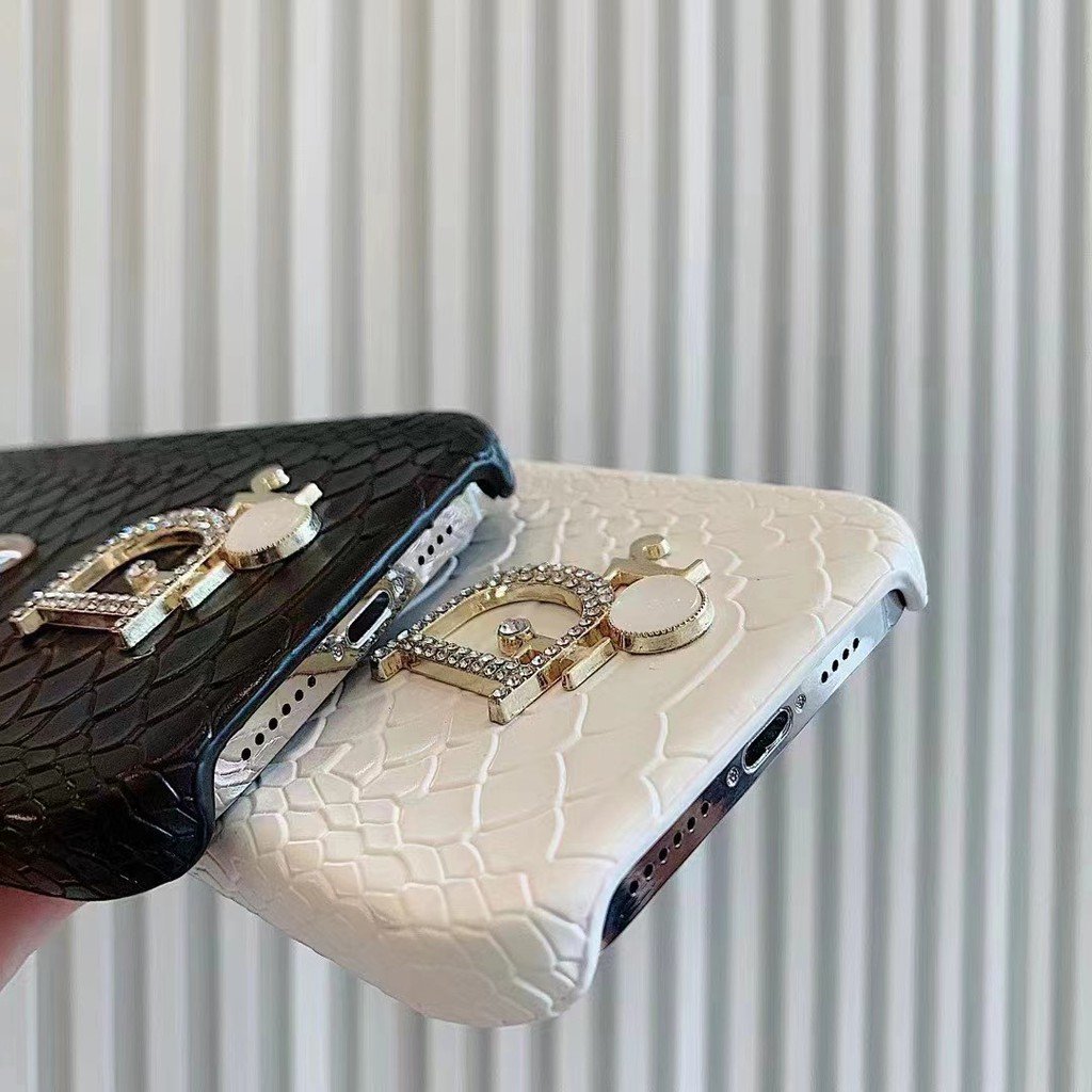 Dior-inspired snake texture iPhone case with emblem detail