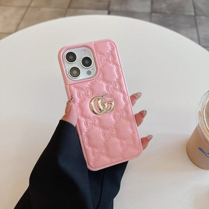 Gucci-inspired quilted iPhone case with metal emblem