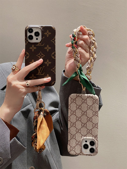Louis Vuitton-inspired phone case with hand strap
