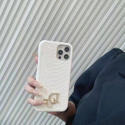 Dior-inspired snake texture iPhone case with emblem detail