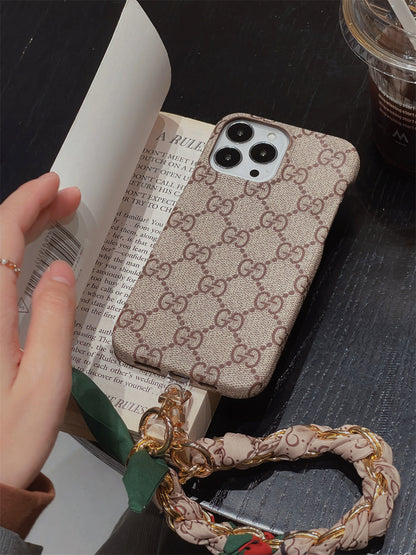 Louis Vuitton-inspired phone case with hand strap