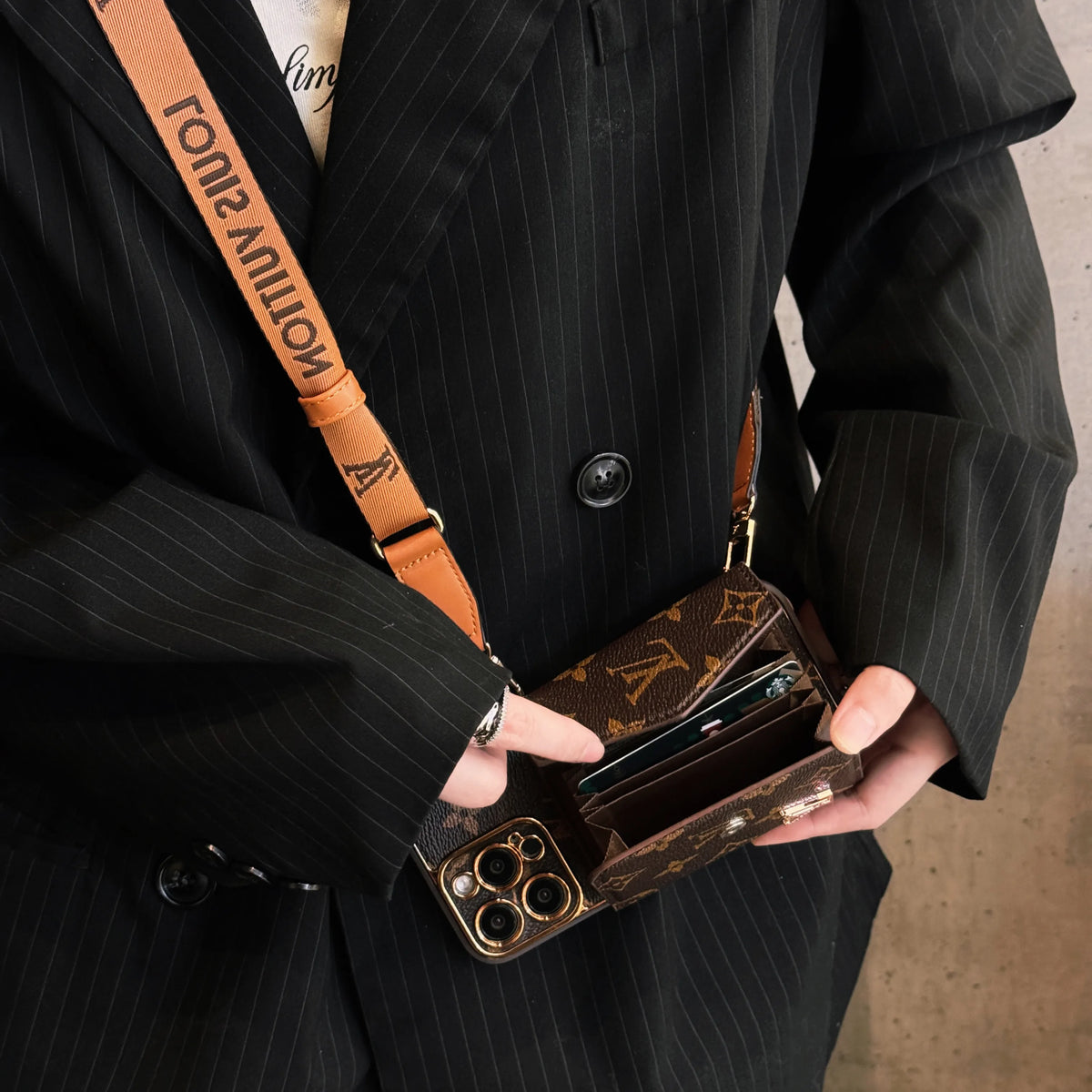 Brown leather iPhone wallet case with strap