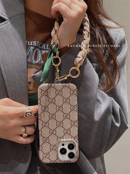 Louis Vuitton-inspired phone case with hand strap