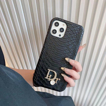 Dior-inspired snake texture iPhone case with emblem detail