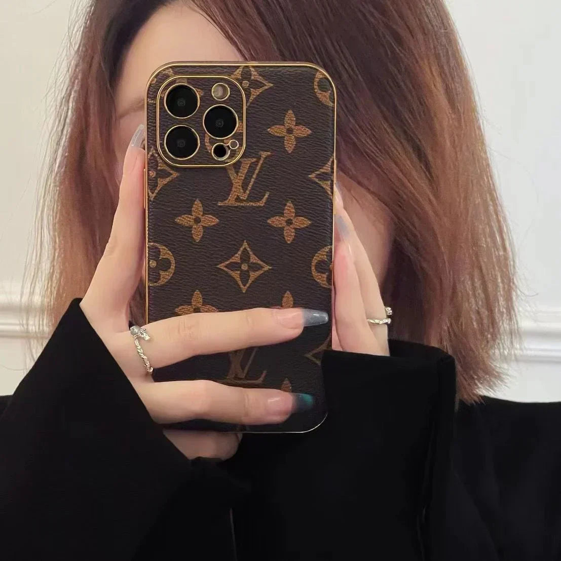 Louis Vuitton-inspired brown monogram iPhone case with emblem