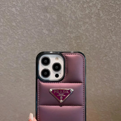 Prada-inspired panelled puffer case with triangle detail