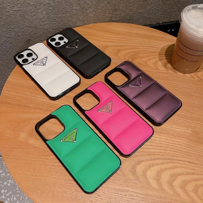 Prada-inspired panelled puffer case with triangle detail