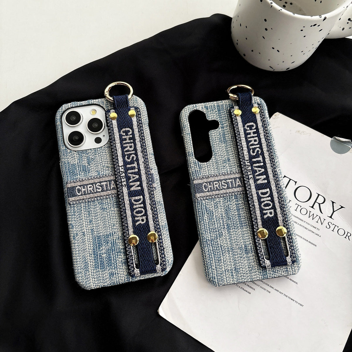 Dior-inspired patterned phone case with wide hand strap