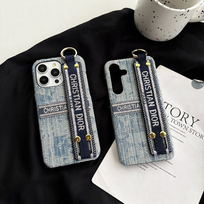 Dior-inspired patterned phone case with wide hand strap