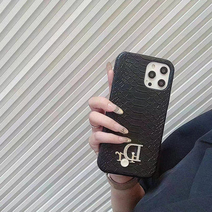 Dior-inspired snake texture iPhone case with emblem detail