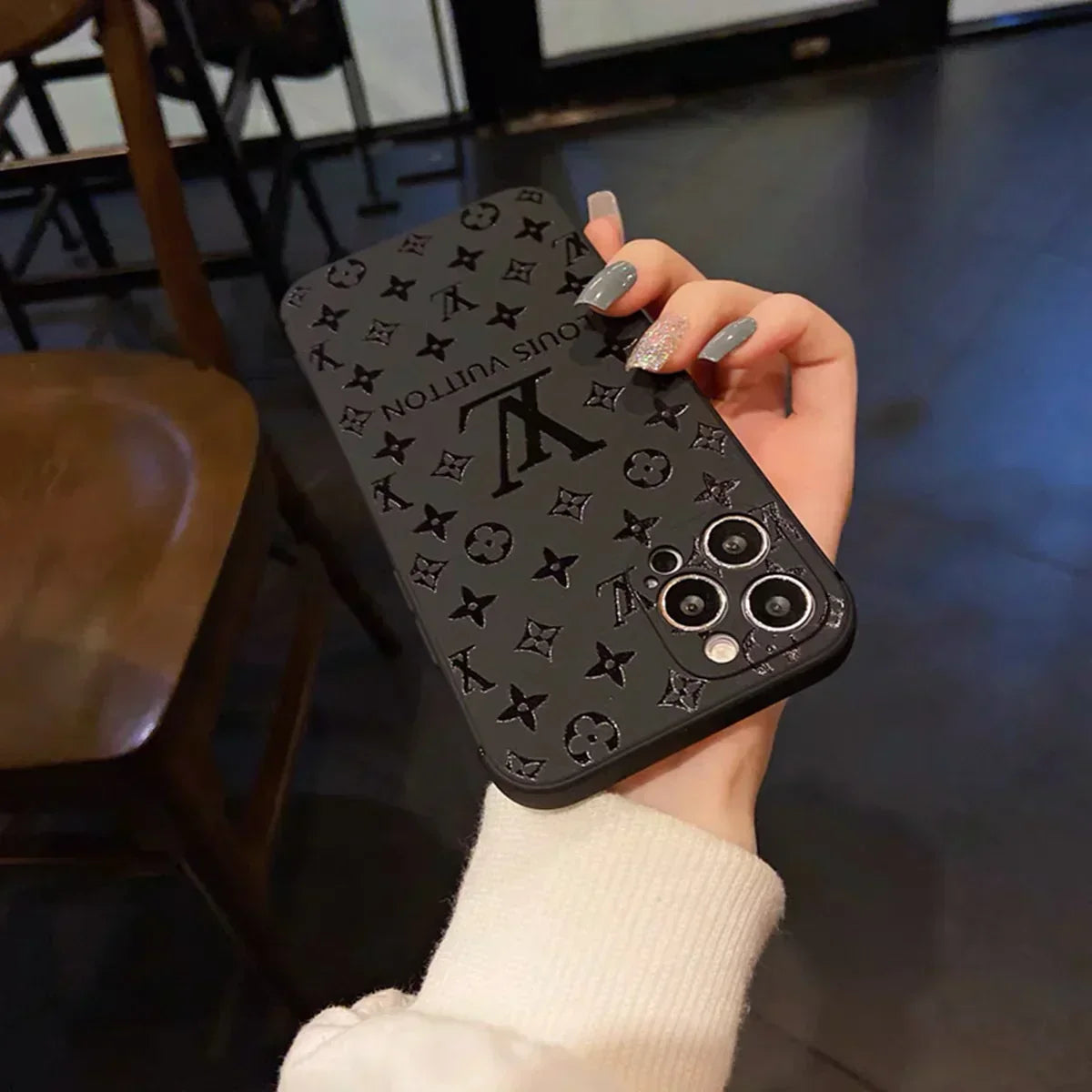 Louis Vuitton-inspired black embossed monogram iPhone 17 case