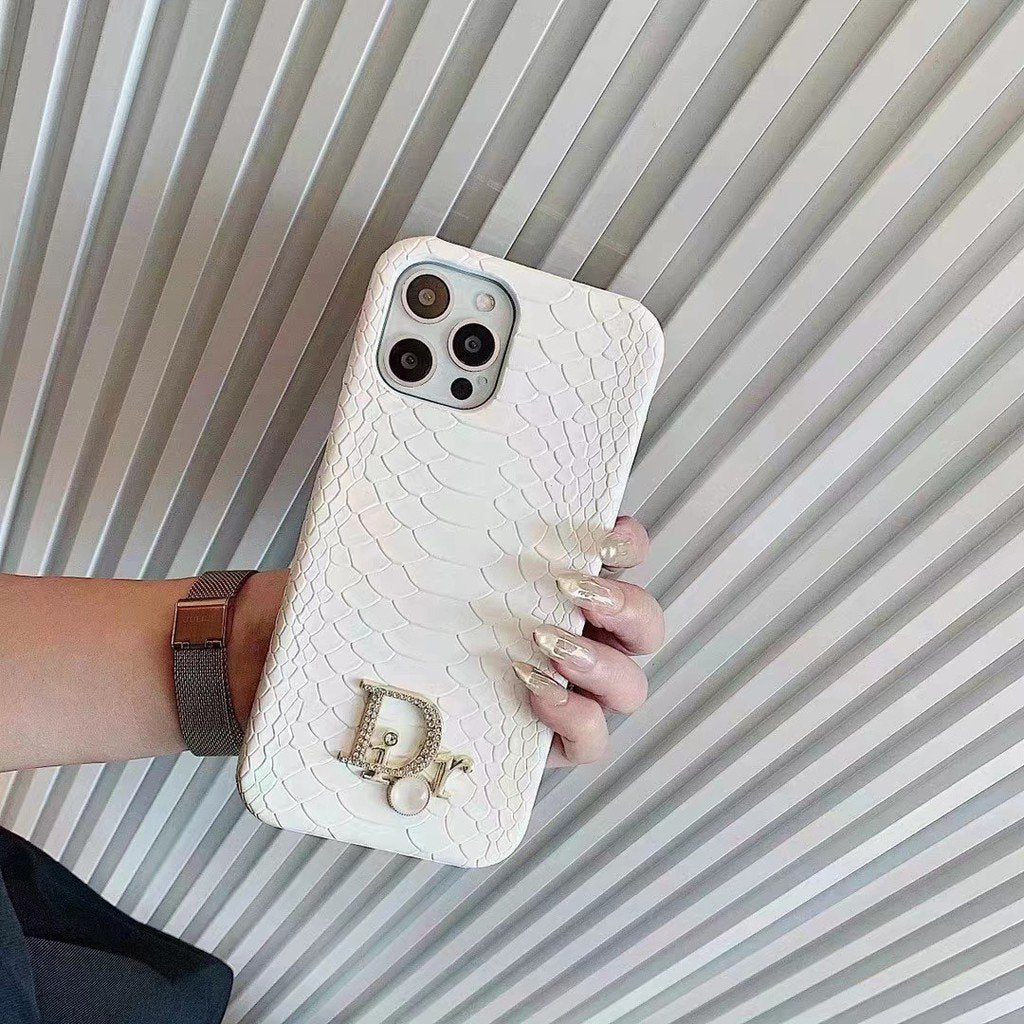 Dior-inspired snake texture iPhone case with emblem detail