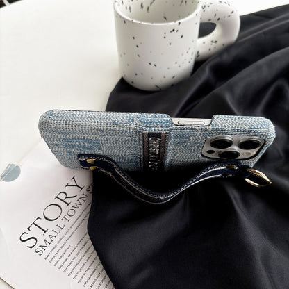 Dior-inspired patterned phone case with wide hand strap