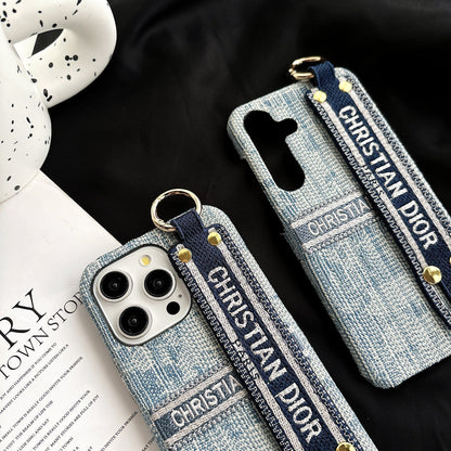 Dior-inspired patterned phone case with wide hand strap