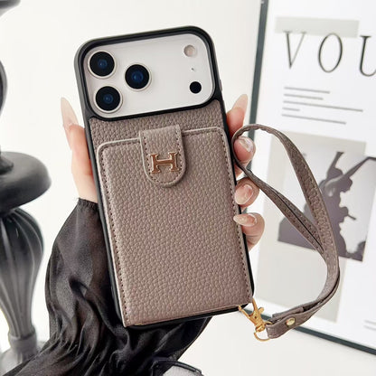 Hermes-inspired solid color iPhone 17 case with card holder and strap