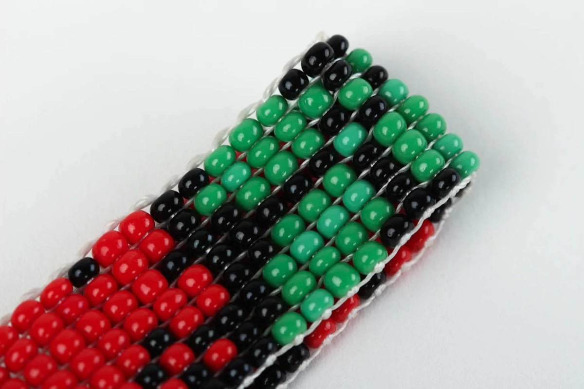 Adjustable green, black, red beads bracelet with floral ornament for her