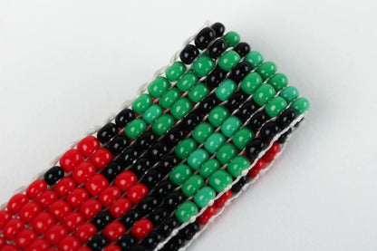 Adjustable green, black, red beads bracelet with floral ornament for her