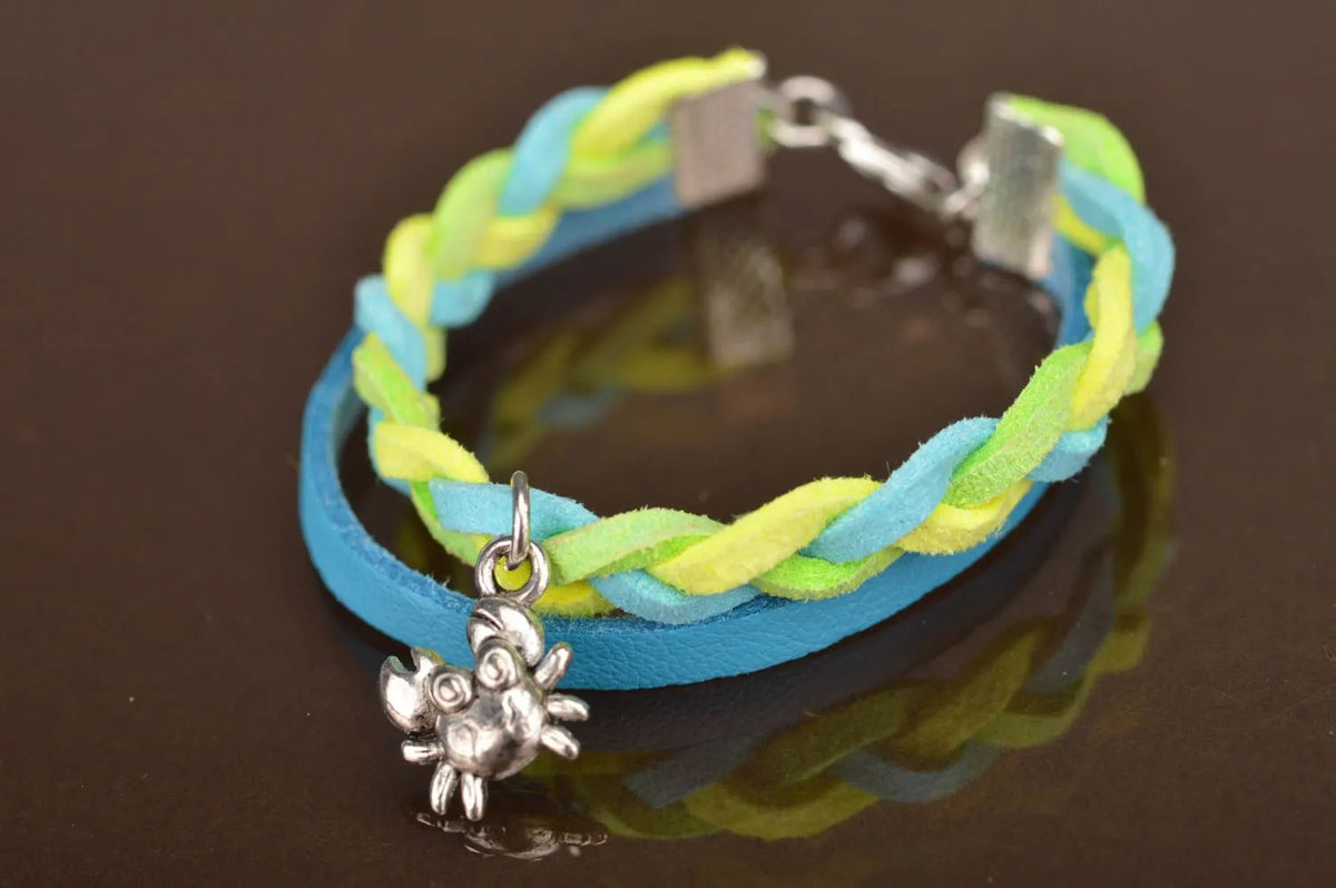 Handmade designer genuine leather cord wrist bracelet blue and yellow with charm
