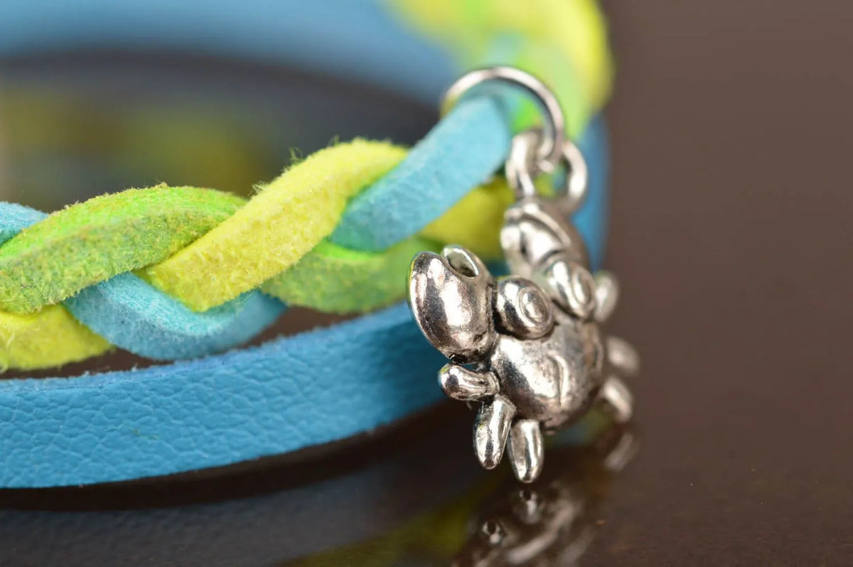 Handmade designer genuine leather cord wrist bracelet blue and yellow with charm