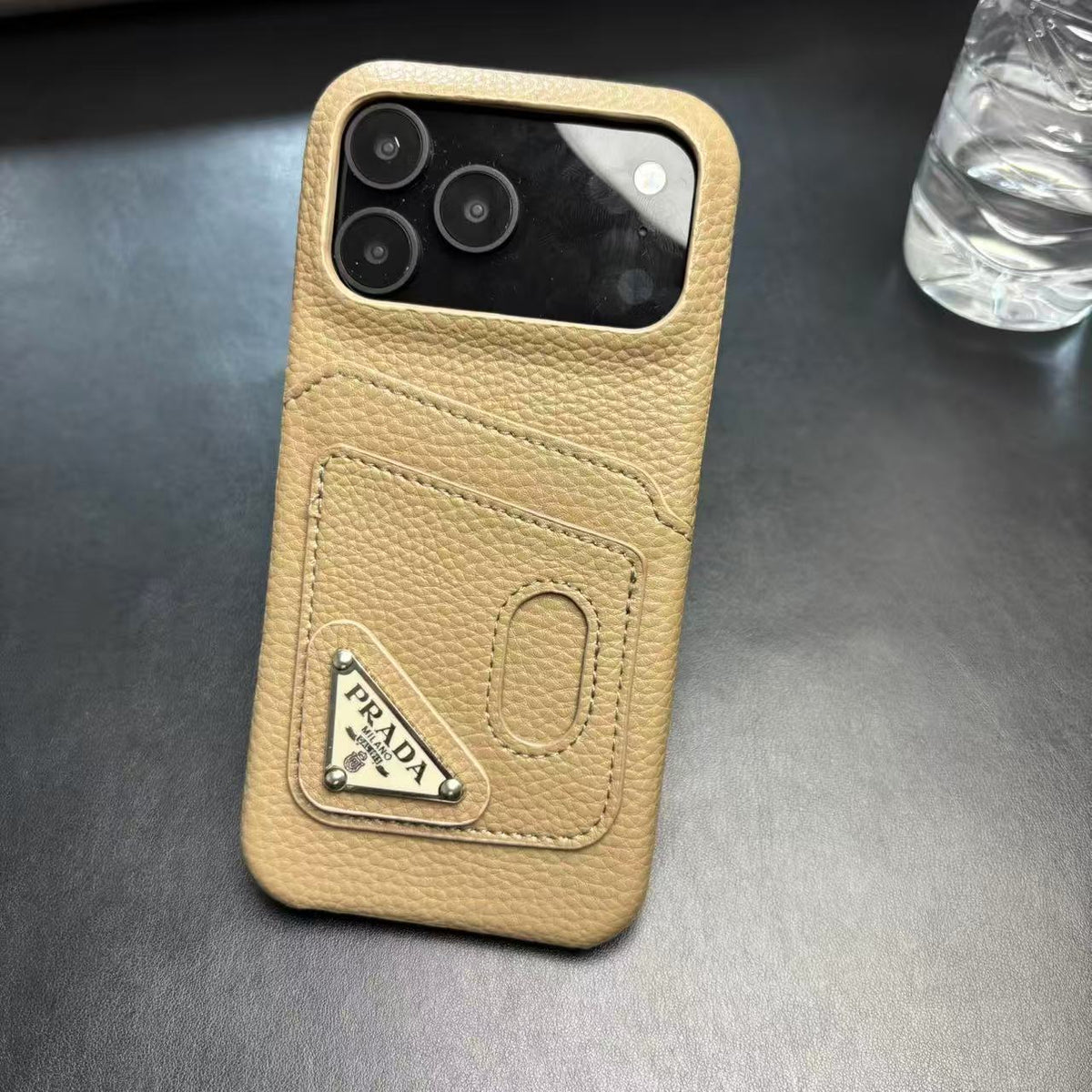 Prada-inspired pastel iPhone 17 Pro case with triangle detail
