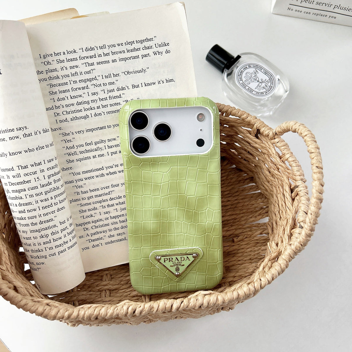 Prada-inspired pastel textured iPhone 17 case with triangle detail