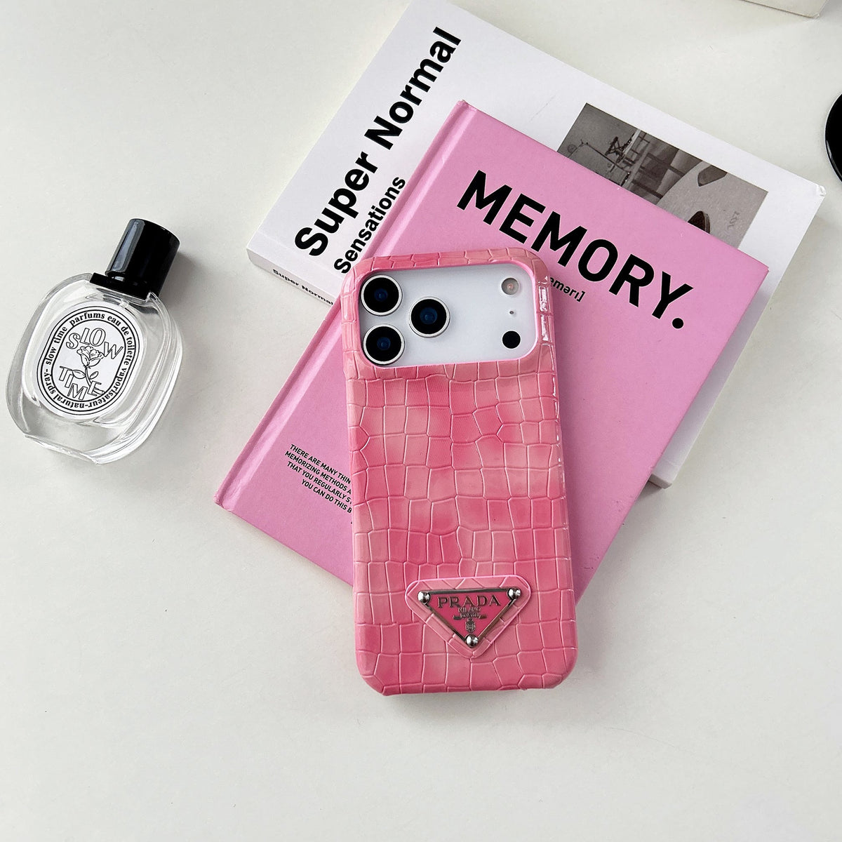 Prada-inspired pastel textured iPhone 17 case with triangle detail