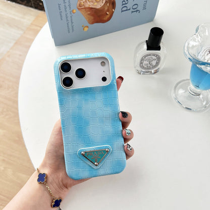 Prada-inspired pastel textured iPhone 17 case with triangle detail