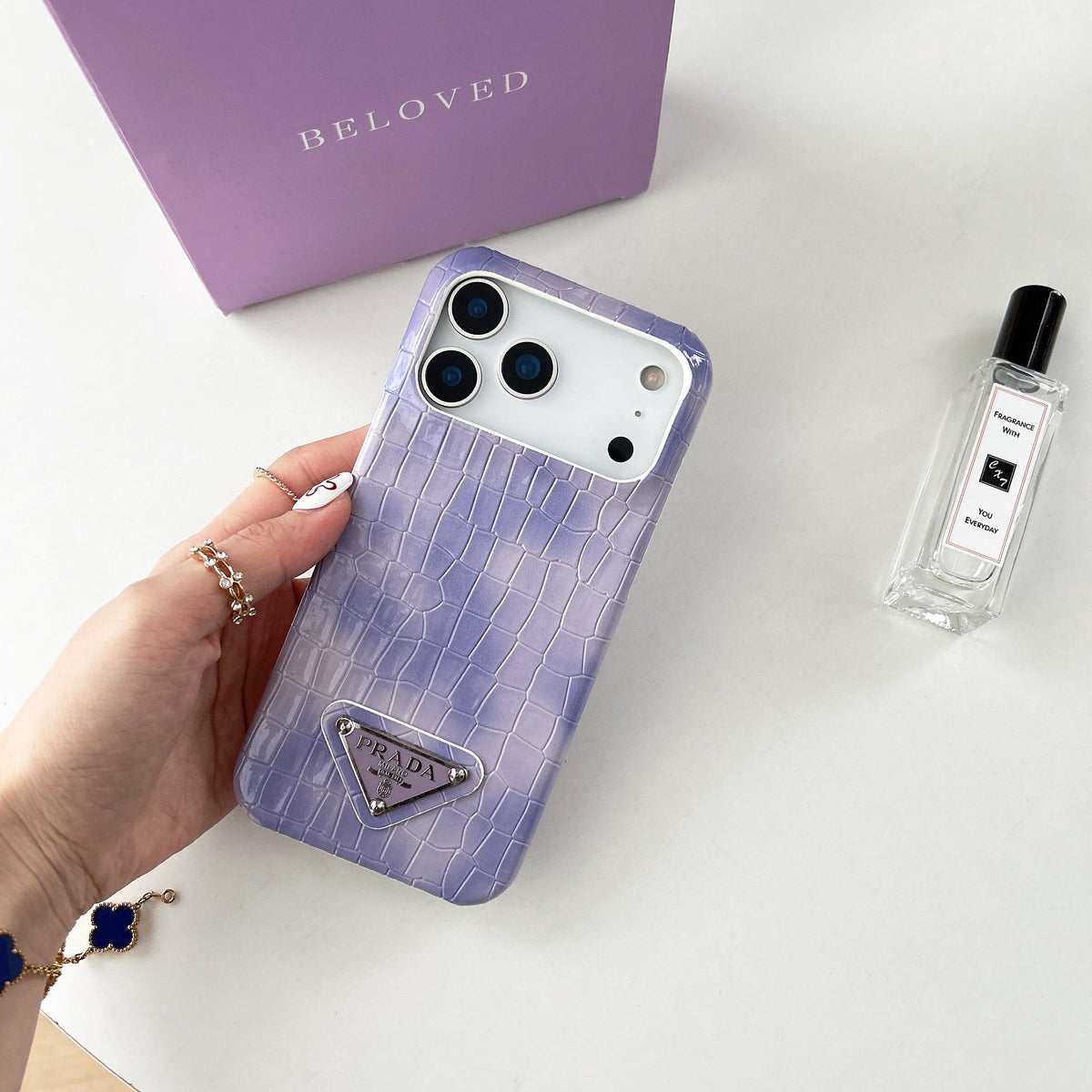 Prada-inspired pastel textured iPhone 17 case with triangle detail