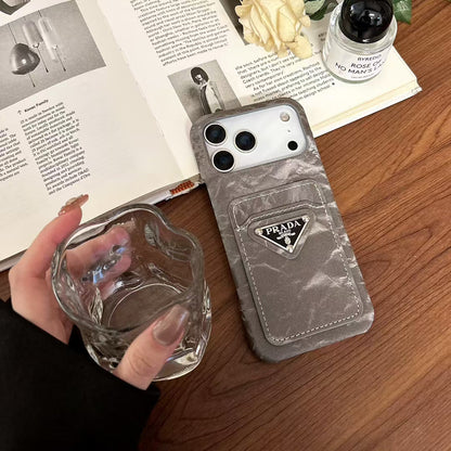 Prada-inspired iPhone 17 case with triangle card pocket
