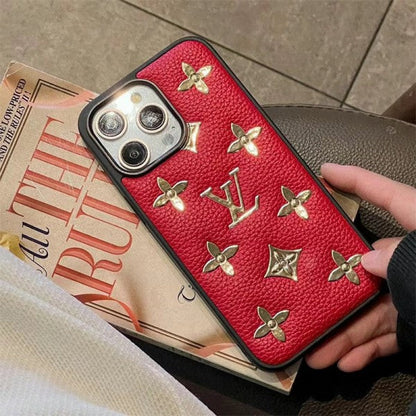 Louis Vuitton-inspired phone case with raised gold-tone pattern